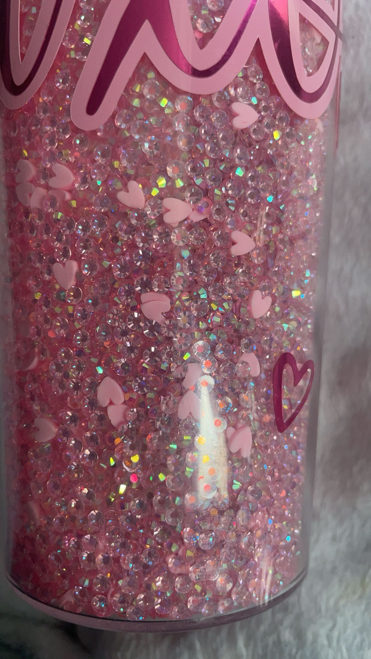 Hugs and kisses xoxo rhinestoned filled tumbler with vinyl decal.